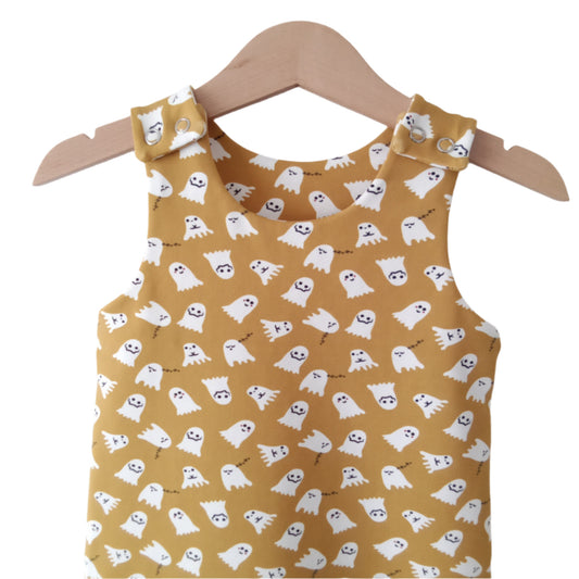 strap detail of a mustard yellow jersey baby romper