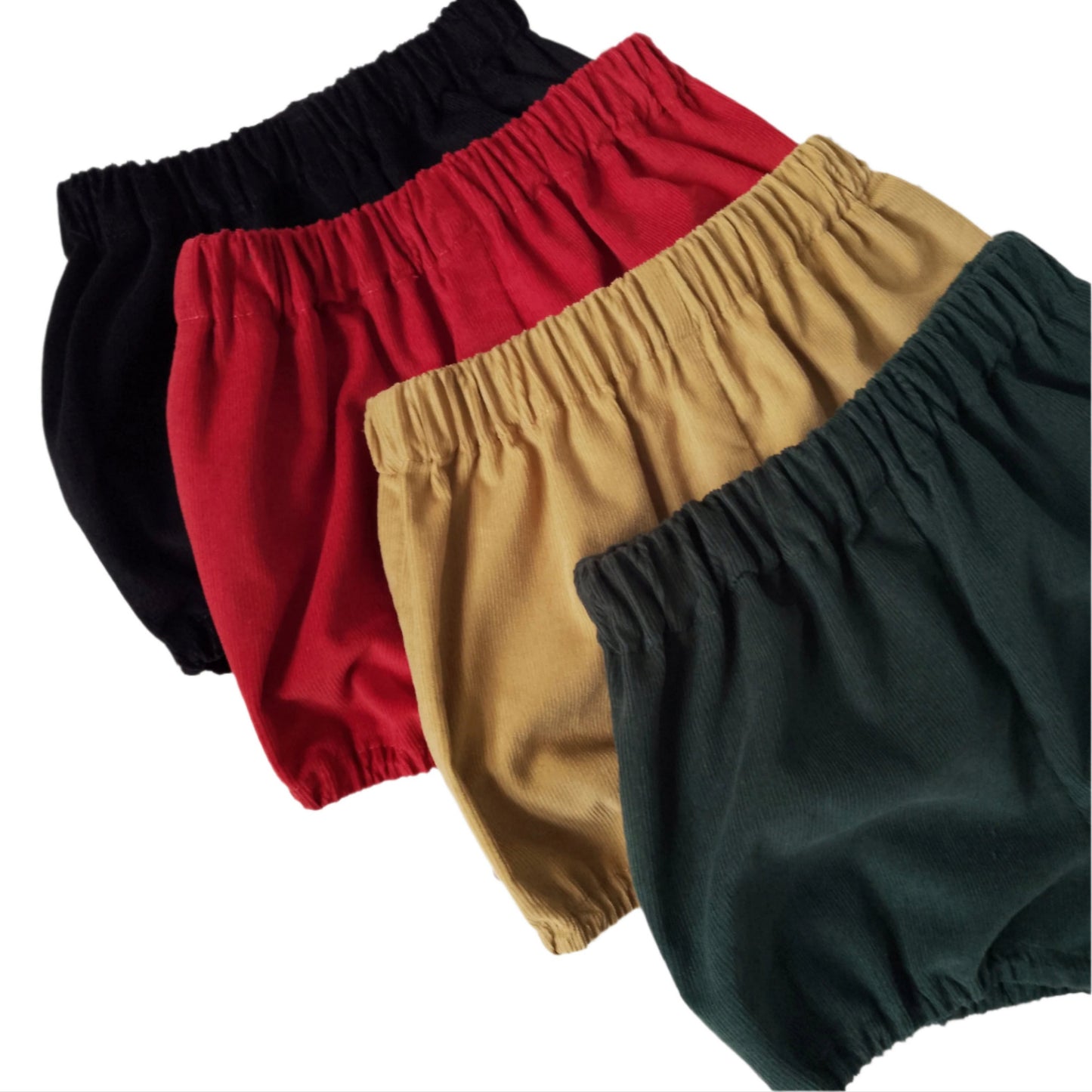 Four pairs of colorful baby bloomers arranged in a row on a white background.