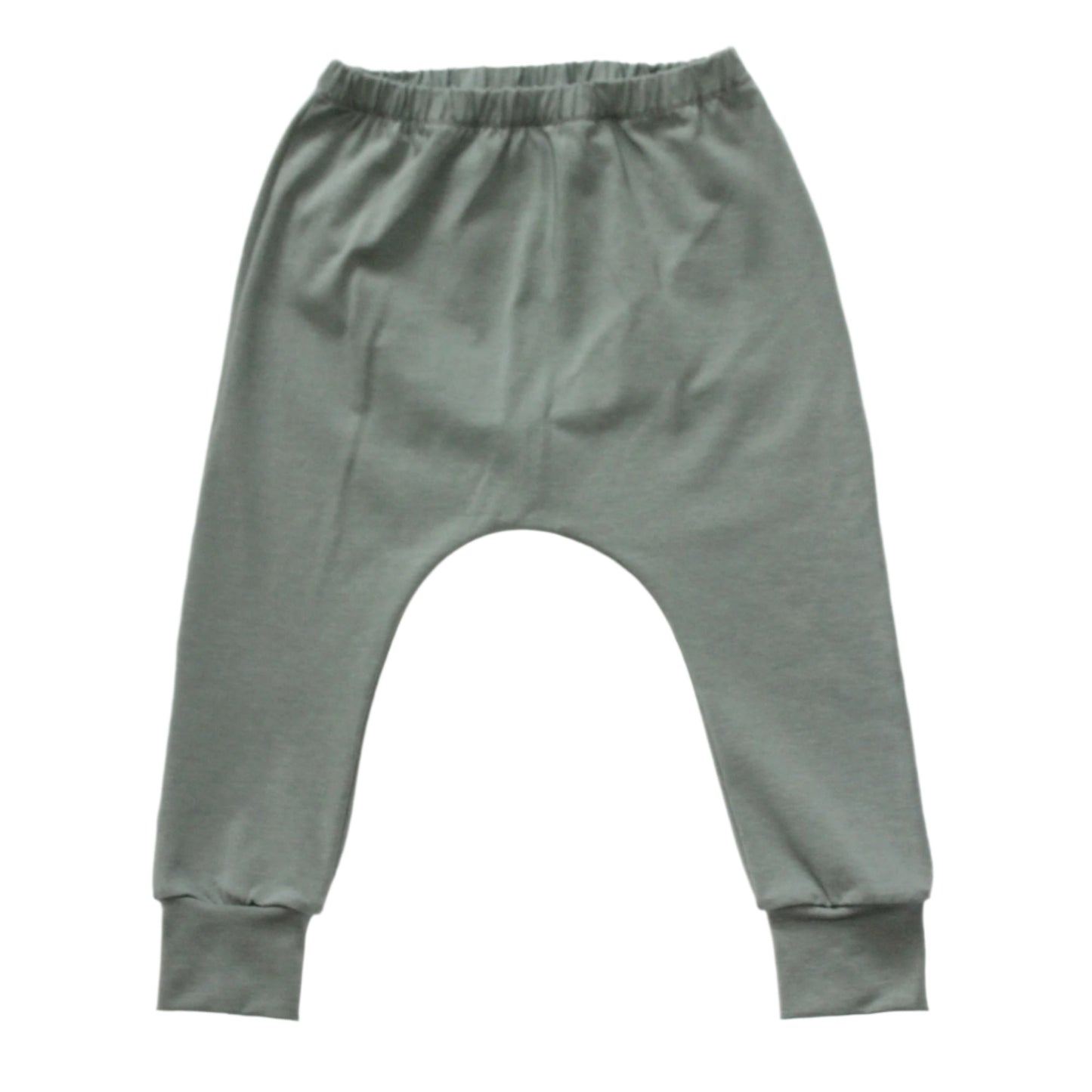still life of a pair of dusty green plain harem leggings, against a white background