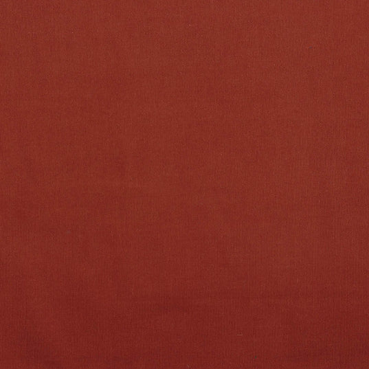 Detail of terracotta cotton corduroy fabric.